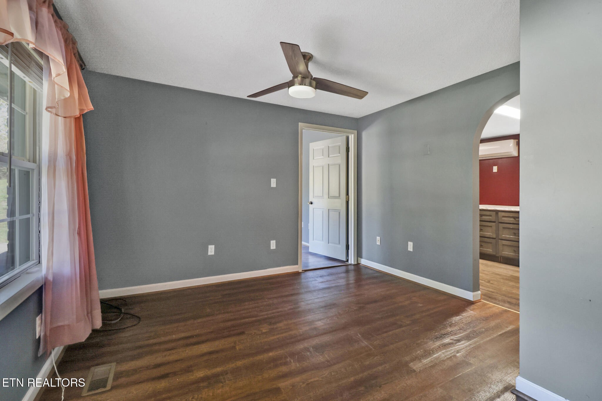 1271 Gouldstown Road Jamestown, TN 38556 - Photo 17 of 52 a view of an empty room with wooden floor and a window
