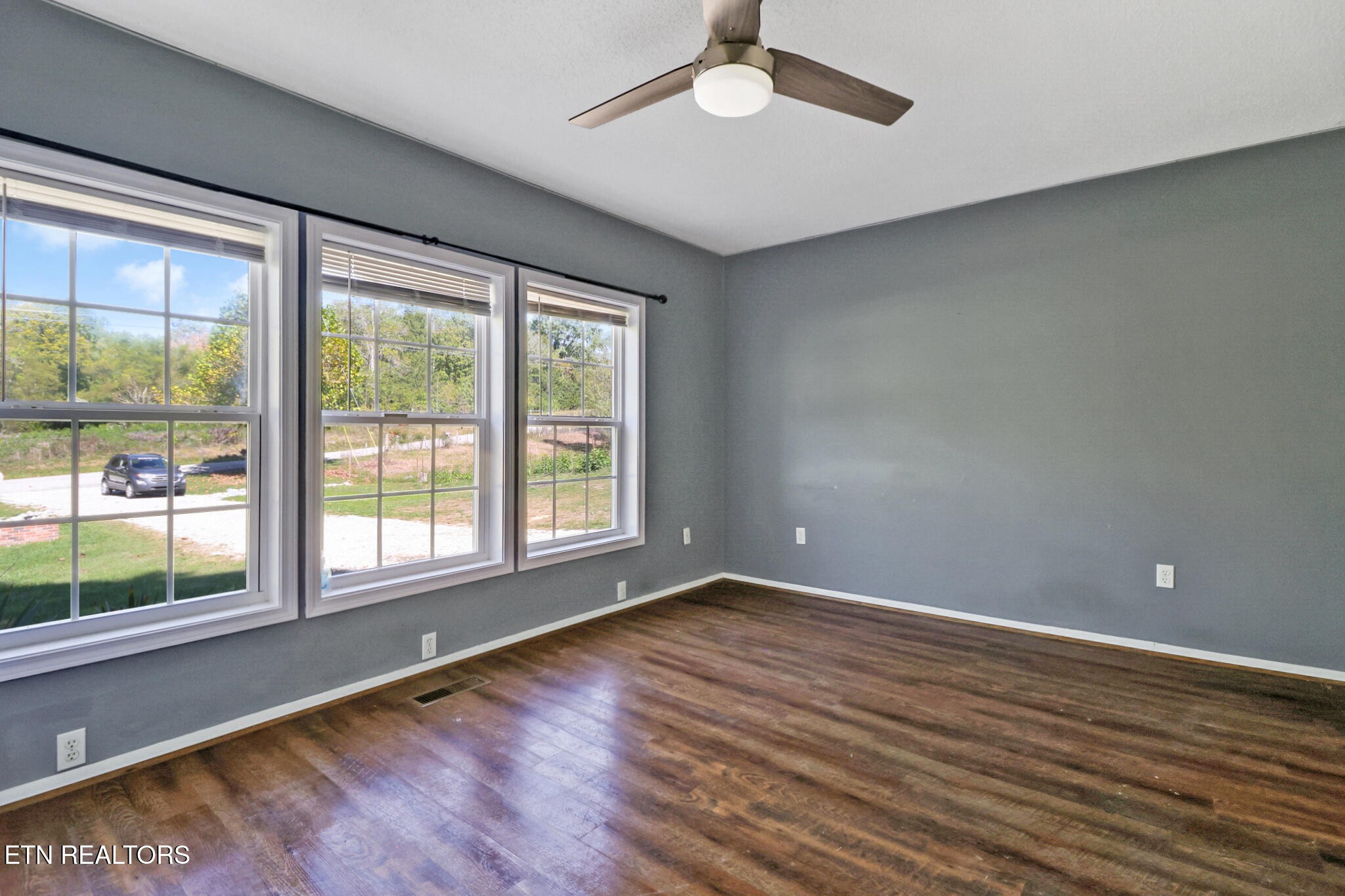 1271 Gouldstown Road Jamestown, TN 38556 - Photo 29 of 52 an empty room with wooden floor and windows