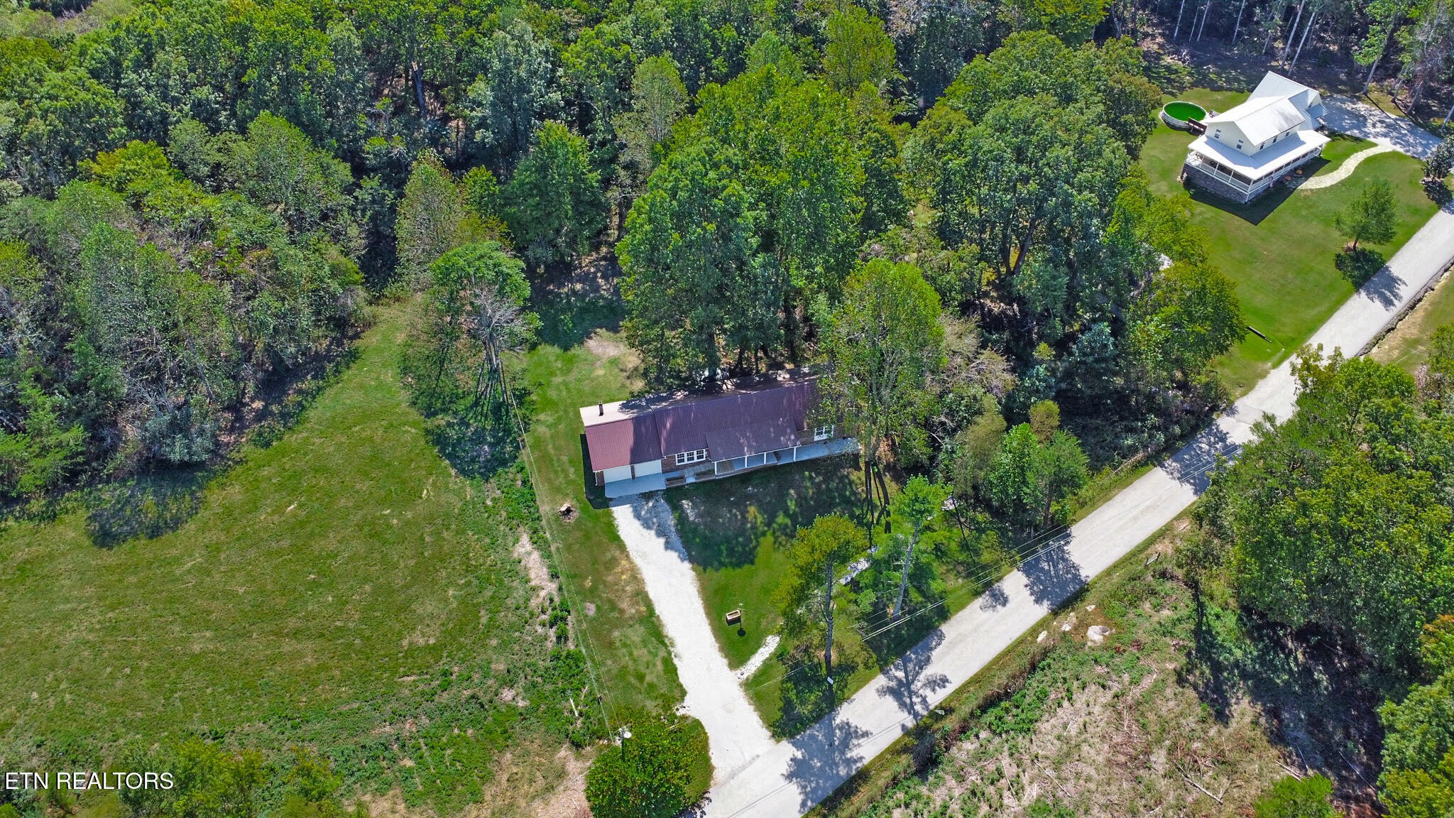 1271 Gouldstown Road Jamestown, TN 38556 - Photo 8 of 52 an aerial view of a house with a yard and outdoor seating