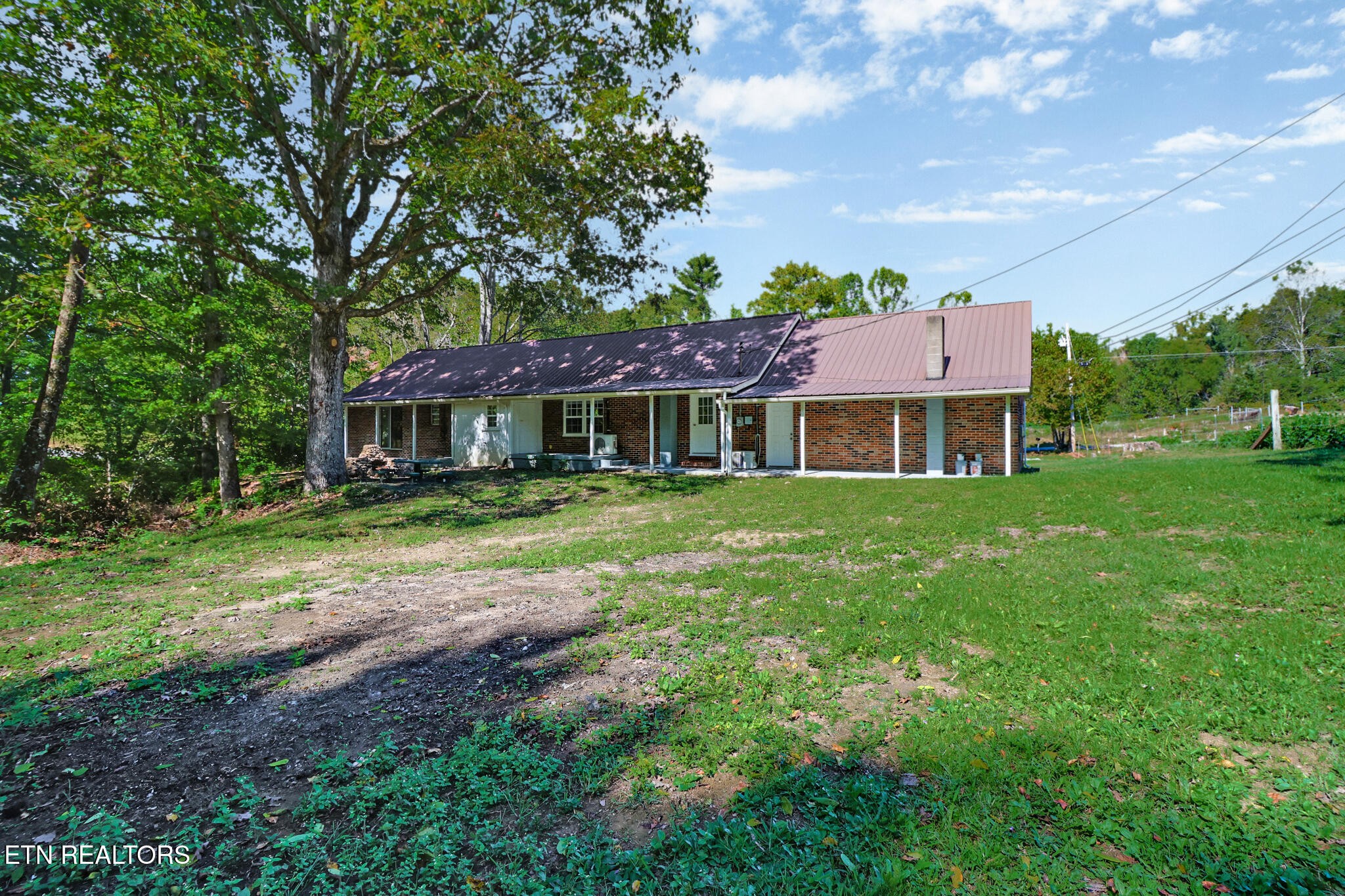 1271 Gouldstown Road Jamestown, TN 38556 - Photo 9 of 52 a front view of a house with a yard