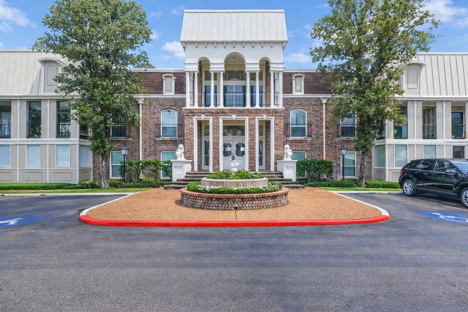 a front view of house with yard and green space