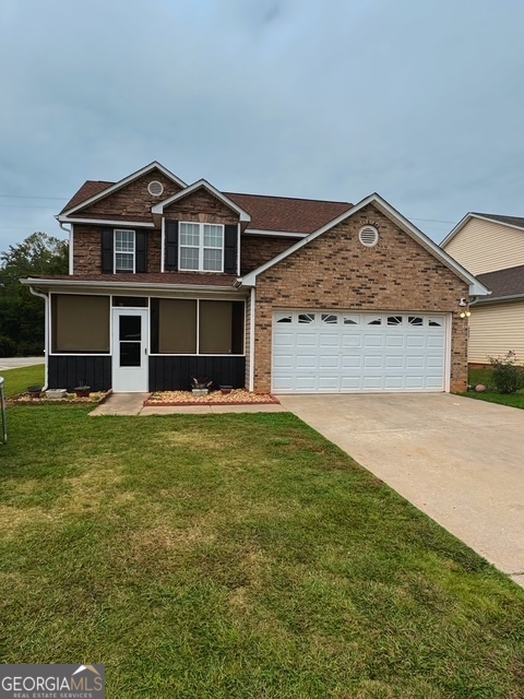 front view of a house with a yard