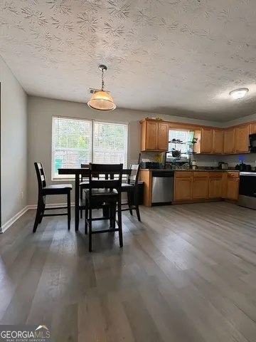 a view of a dining room with furniture window and outside view