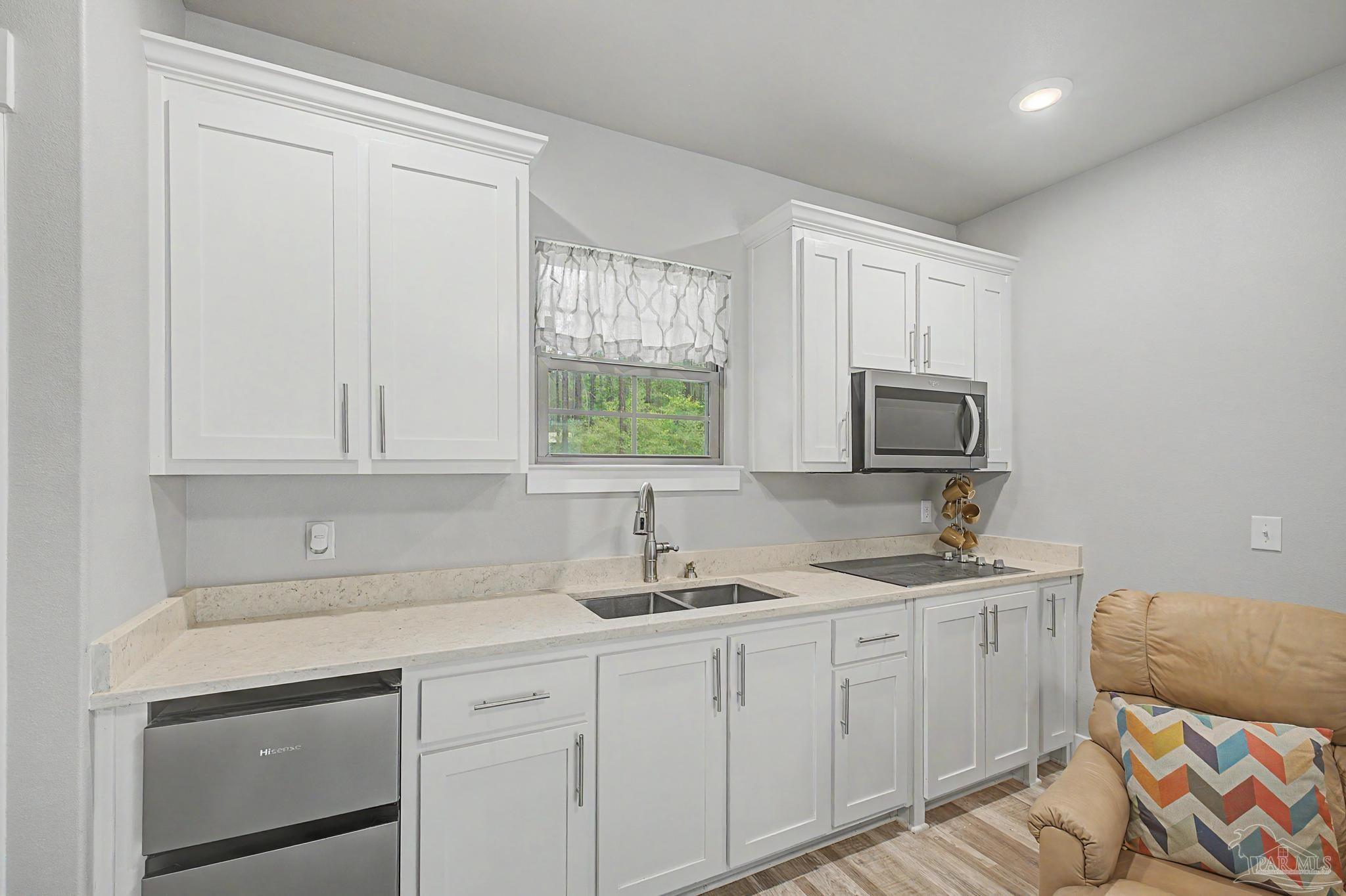 1918 Pineview Church Road Jay, FL 32565 - Photo 18 of 45 a kitchen with stainless steel appliances granite countertop a sink a stove and a microwave