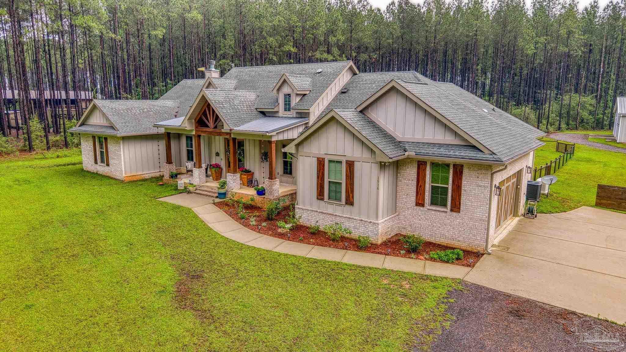 1918 Pineview Church Road Jay, FL 32565 - Photo 2 of 45 a view of a house with pool and sitting area
