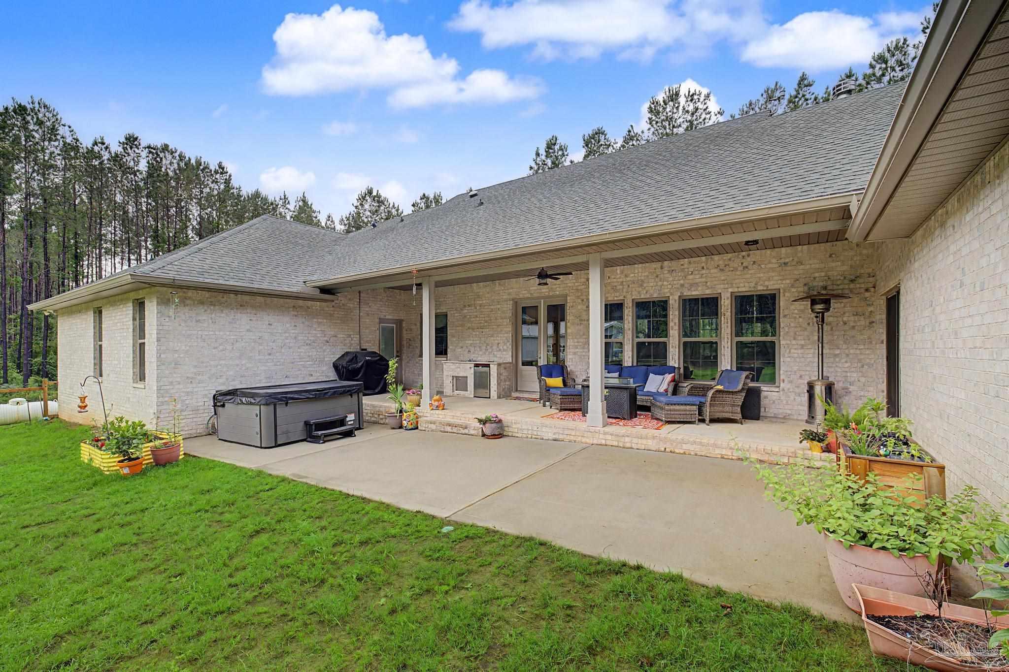 1918 Pineview Church Road Jay, FL 32565 - Photo 27 of 45 a front view of a house with patio and garden