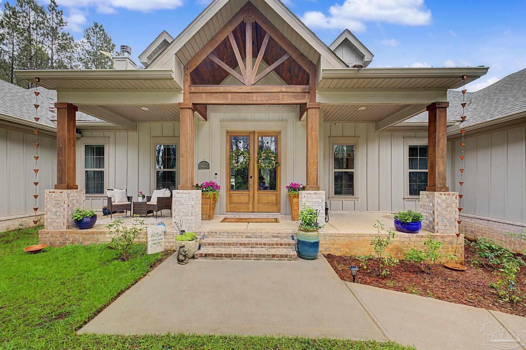 1918 Pineview Church Road Jay, FL 32565 - Photo 3 of 45 a front view of a house with garden