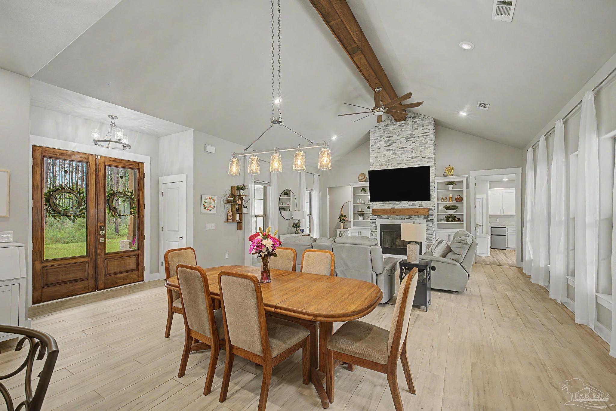 1918 Pineview Church Road Jay, FL 32565 - Photo 5 of 45 a view of a dining room with furniture and a flat screen tv