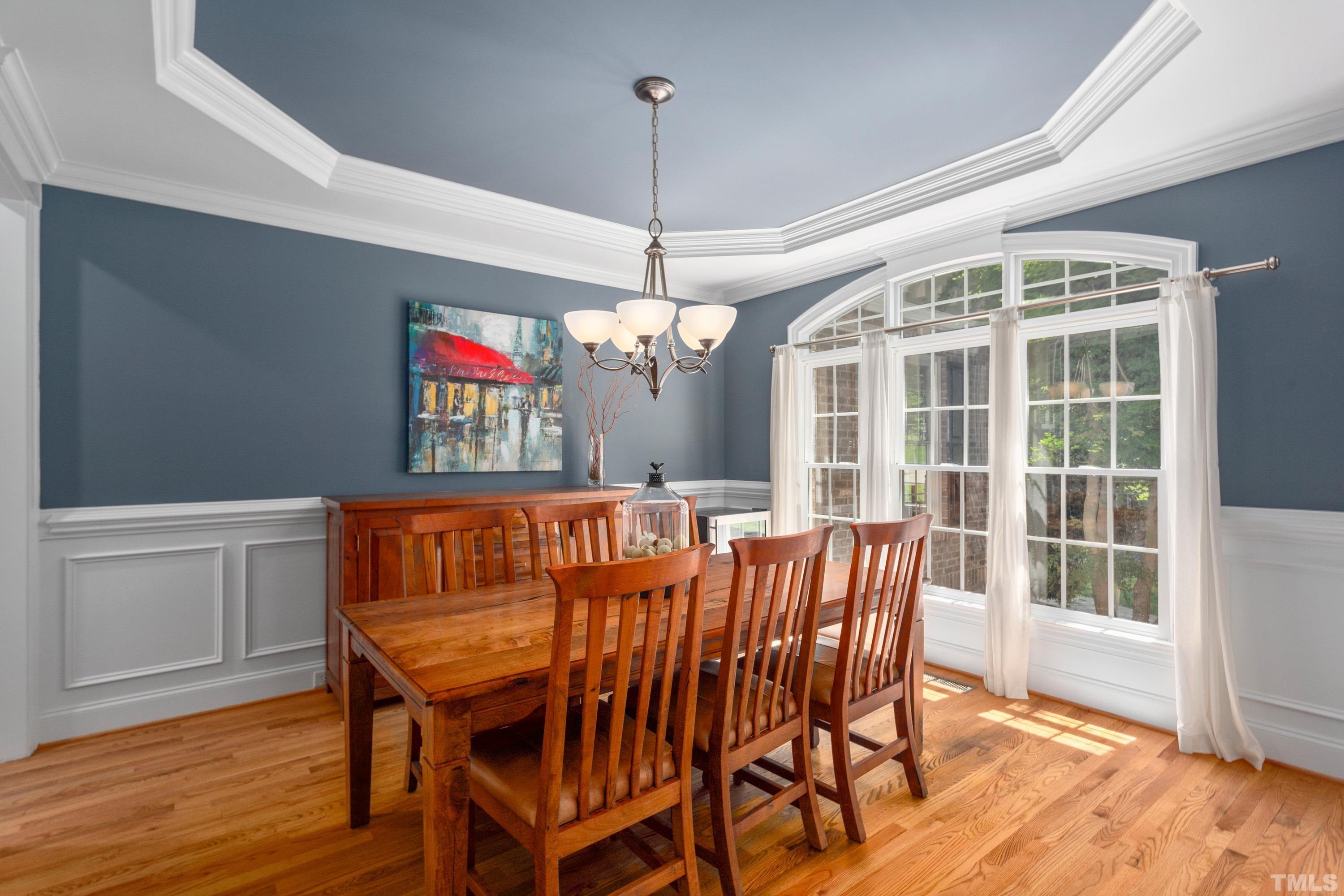 3728 Grandbridge Drive Apex, NC 27539 - Photo 14 of 76 a view of a dining room with furniture wooden floor and chandelier