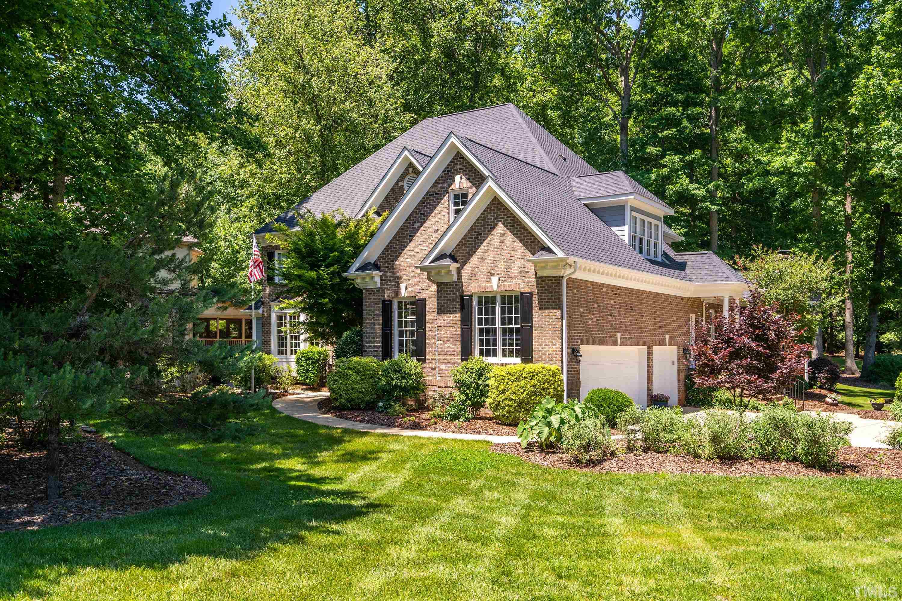 3728 Grandbridge Drive Apex, NC 27539 - Photo 2 of 76 a front view of house with yard and green space