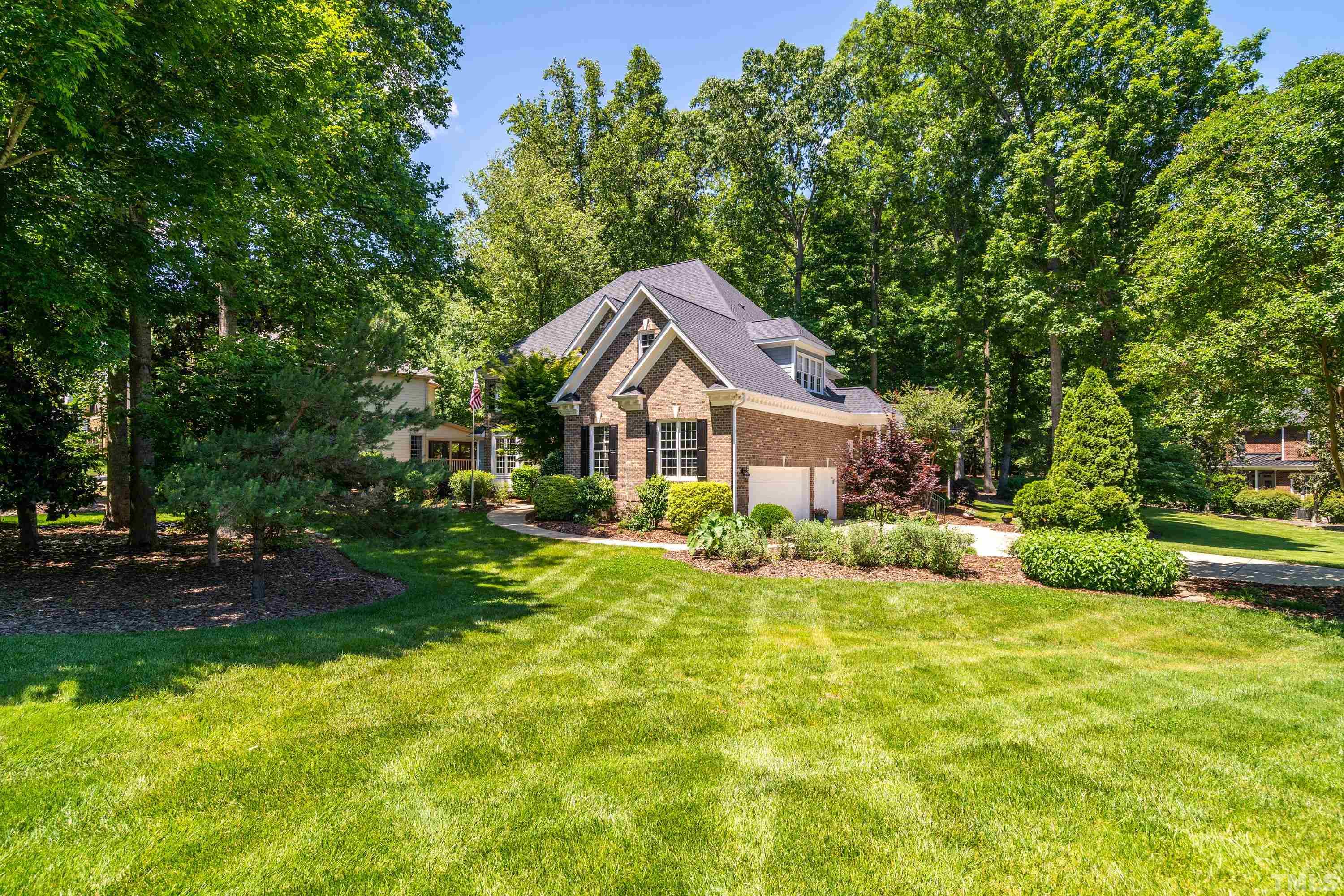 3728 Grandbridge Drive Apex, NC 27539 - Photo 3 of 76 a house view with a garden space