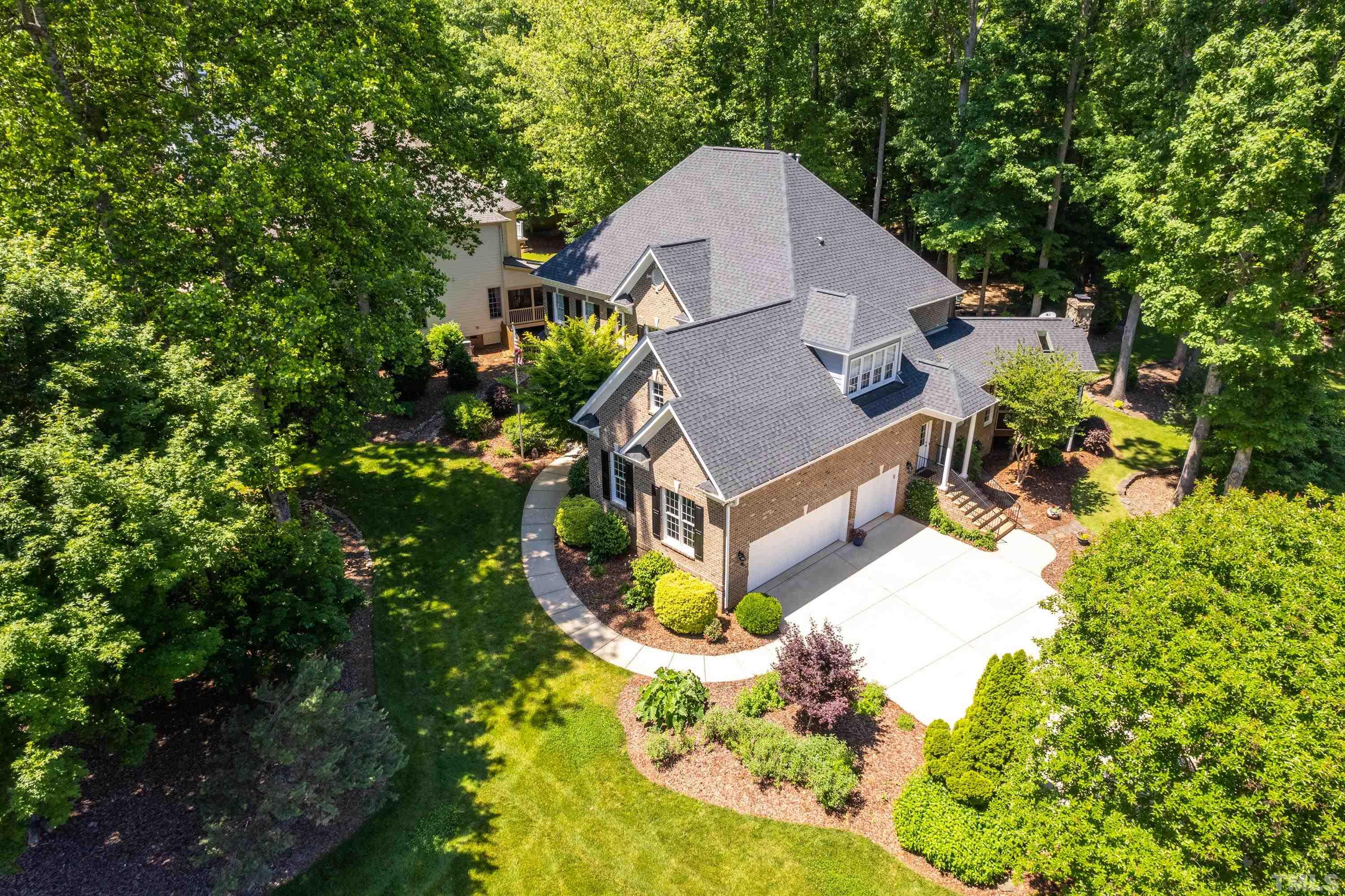 3728 Grandbridge Drive Apex, NC 27539 - Photo 75 of 76 a aerial view of a house with a yard and large trees