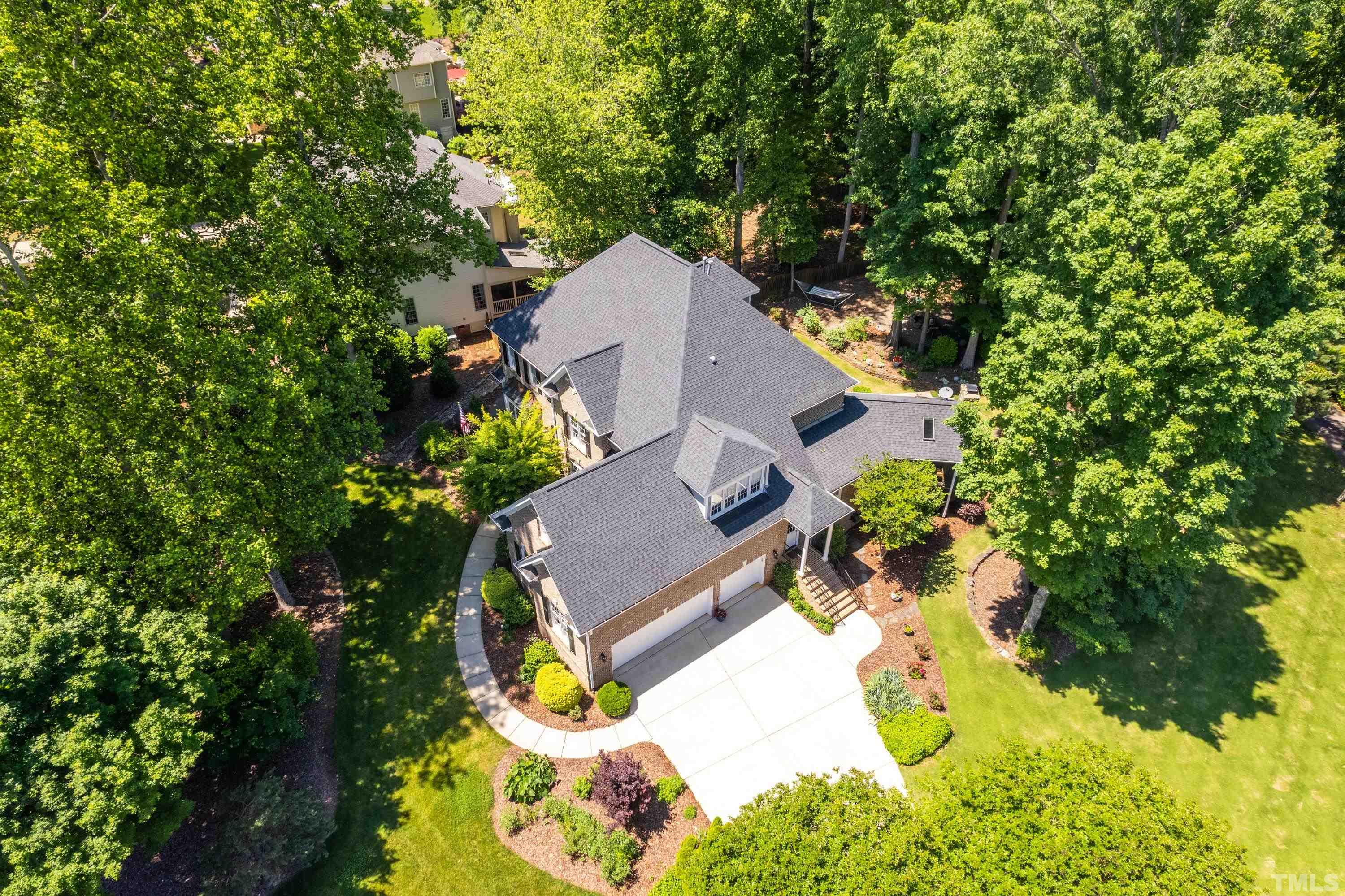 3728 Grandbridge Drive Apex, NC 27539 - Photo 76 of 76 an aerial view of a house with swimming pool and large trees