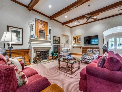 a living room with furniture or couch and a ceiling fan