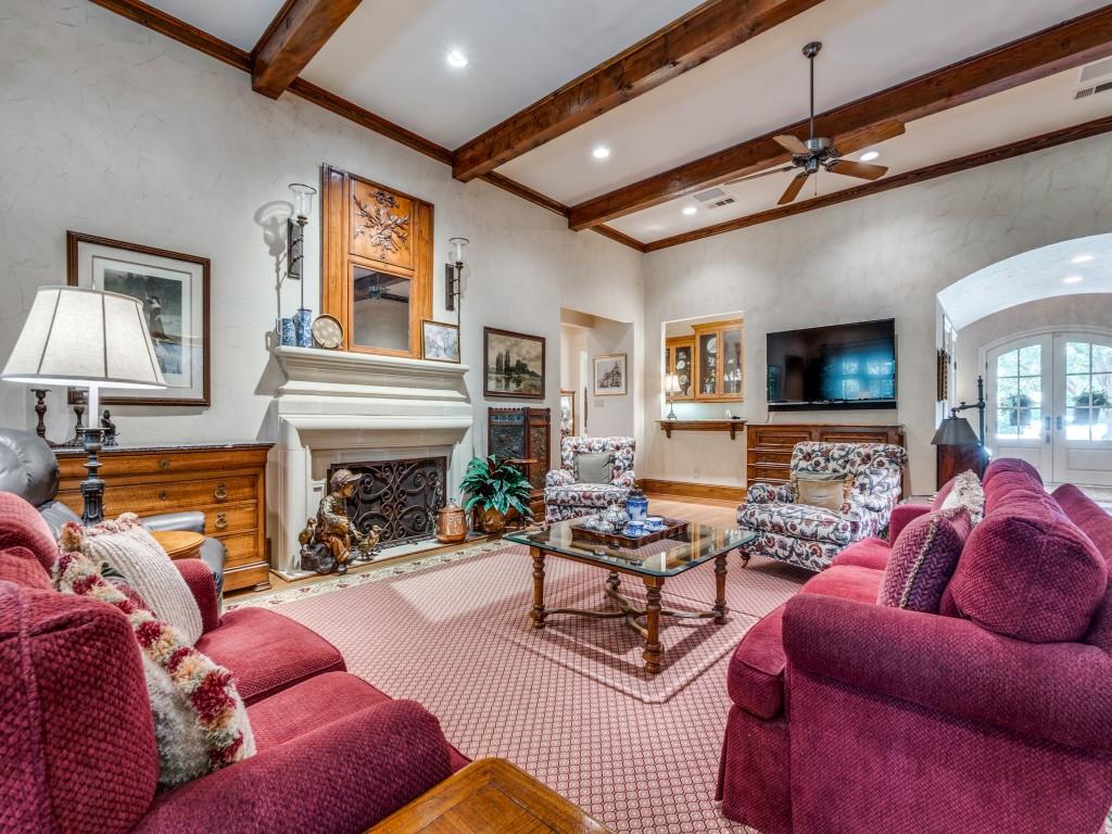 4420 Park Lane Dallas, TX 75220 - Photo 13 of 40 a living room with furniture a fireplace and a flat screen tv