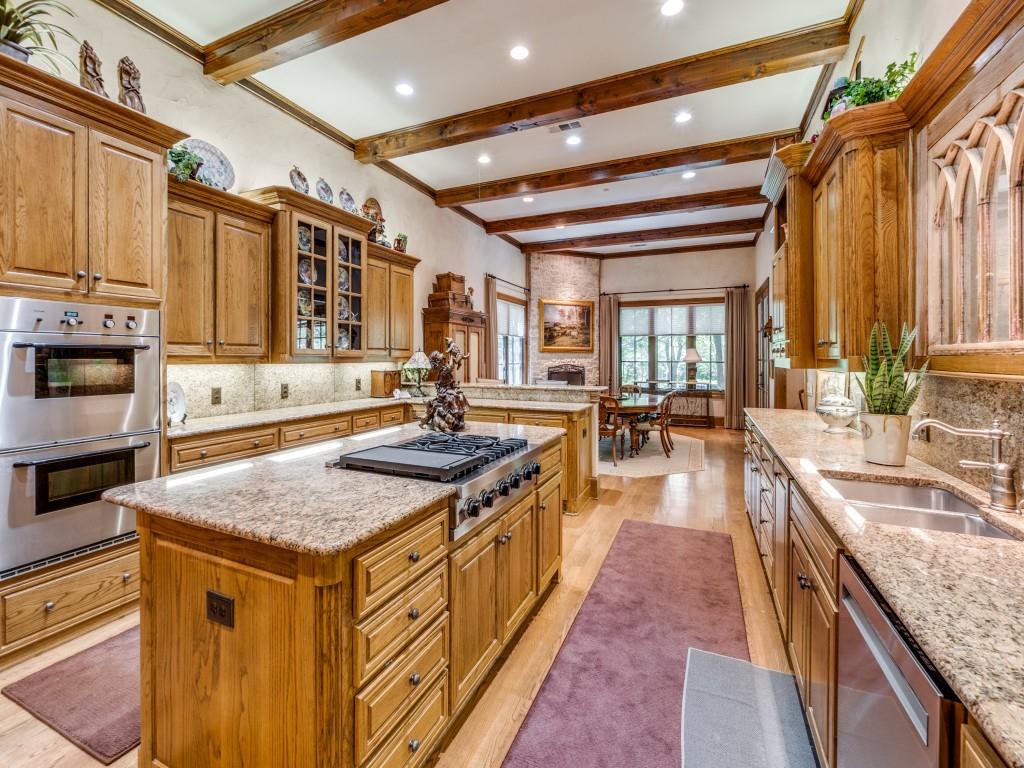4420 Park Lane Dallas, TX 75220 - Photo 17 of 40 a kitchen with stainless steel appliances granite countertop a sink stove and cabinets