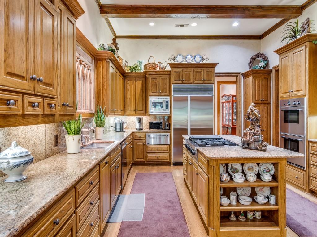 4420 Park Lane Dallas, TX 75220 - Photo 19 of 40 a kitchen with stainless steel appliances granite countertop a stove a sink and a refrigerator