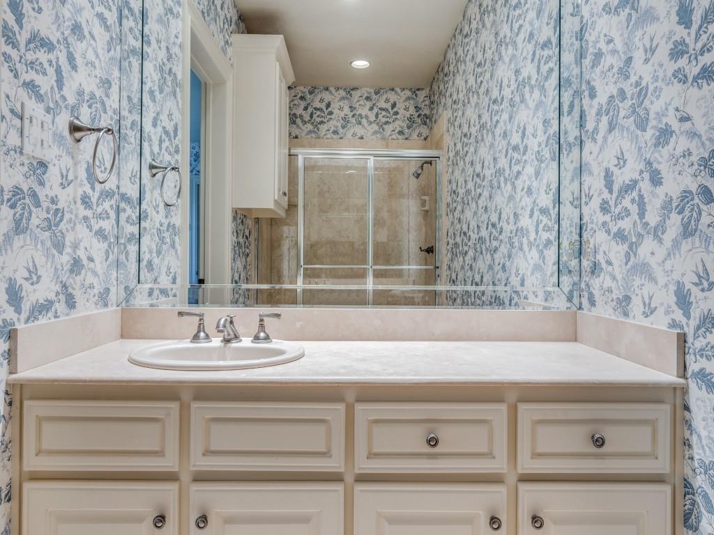 4420 Park Lane Dallas, TX 75220 - Photo 26 of 40 a bathroom with a sink and a mirror