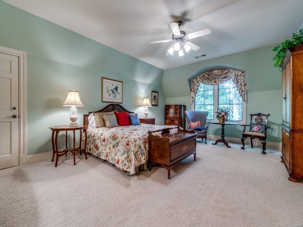 4420 Park Lane Dallas, TX 75220 - Photo 30 of 40 a bedroom with a bed and a chandelier