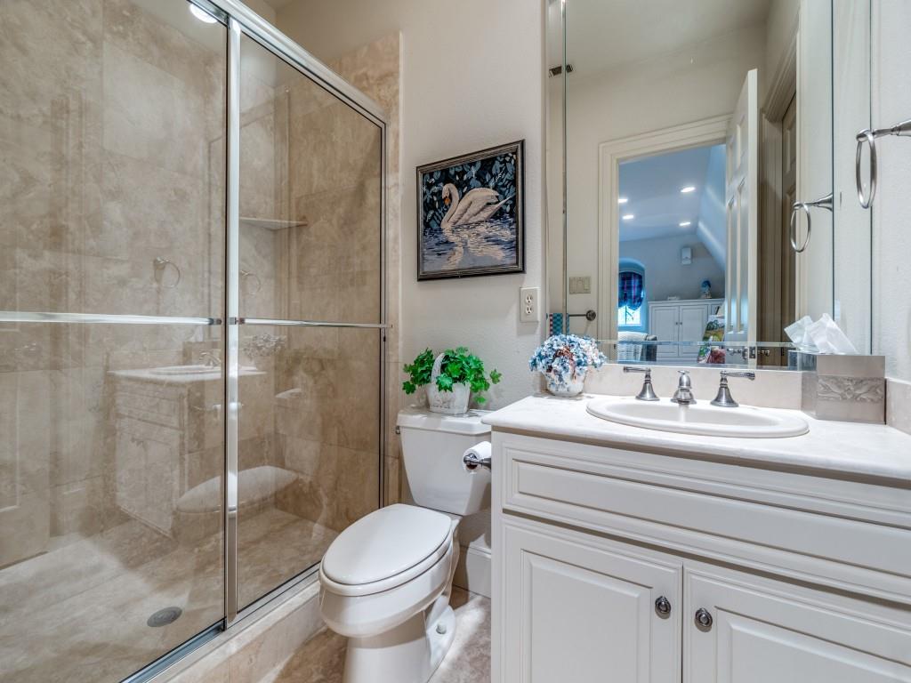 4420 Park Lane Dallas, TX 75220 - Photo 34 of 40 a bathroom with a sink toilet and shower
