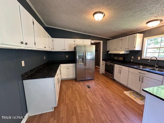 83 Ridge Lane Autryville, NC 28318 - Photo 2 of 13 a kitchen with stainless steel appliances a refrigerator a sink a stove a microwave and cabinets