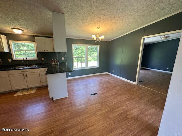83 Ridge Lane Autryville, NC 28318 - Photo 3 of 13 a kitchen with granite countertop a stove a sink and a microwave