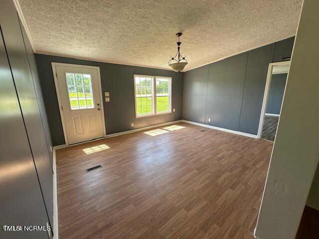 83 Ridge Lane Autryville, NC 28318 - Photo 4 of 13 a view of an empty room with wooden floor and a window