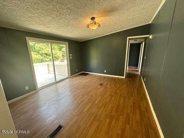 83 Ridge Lane Autryville, NC 28318 - Photo 8 of 13 a view of an empty room with wooden floor and a window