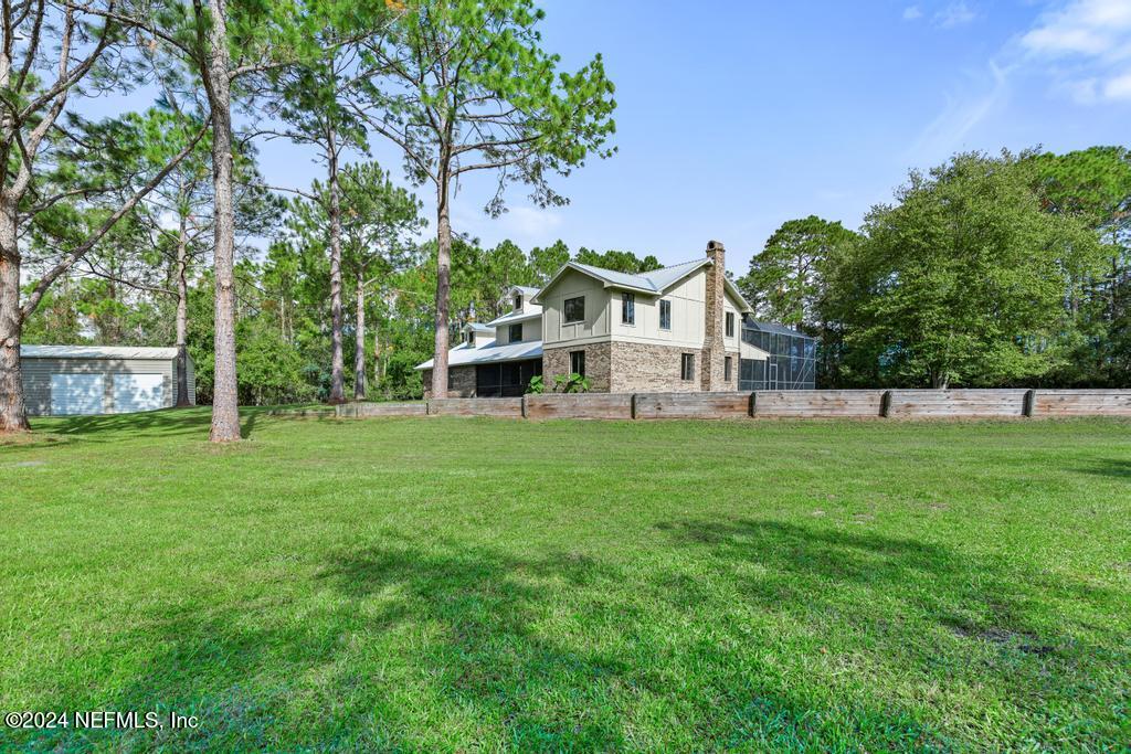 2552 St Augustine Boulevard St. Augustine, FL 32086 - Photo 34 of 50 a view of a house with backyard sitting area and garden