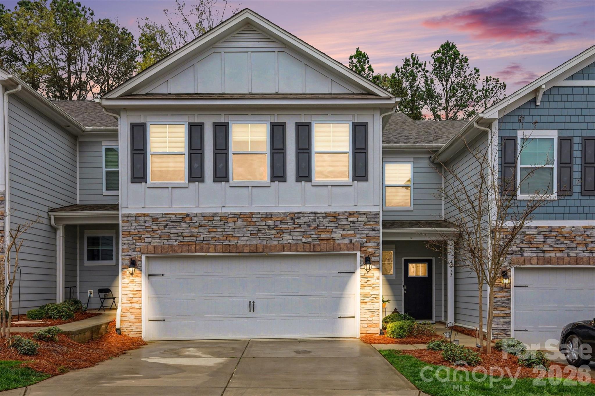 4293 Plumeria Way Fort Mill, SC 29707 - Photo 1 of 33 a front view of a house with garage