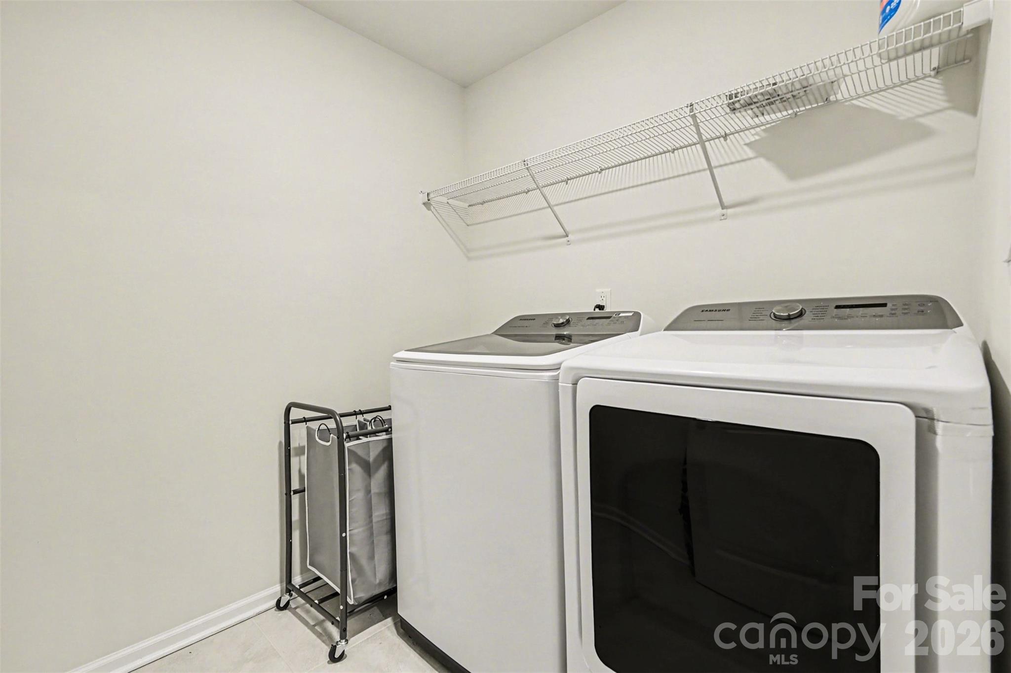 4293 Plumeria Way Fort Mill, SC 29707 - Photo 13 of 33 a utility room with dryer and washer