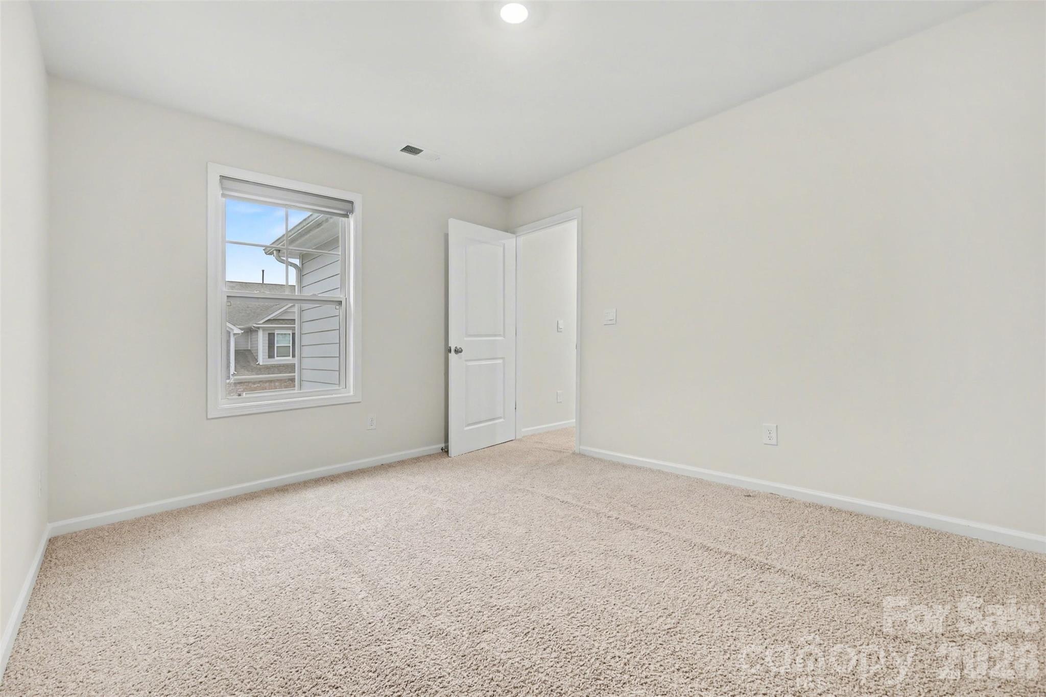 4293 Plumeria Way Fort Mill, SC 29707 - Photo 16 of 33 a view of an empty room with a window