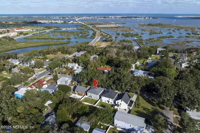 an aerial view of residential building and lake