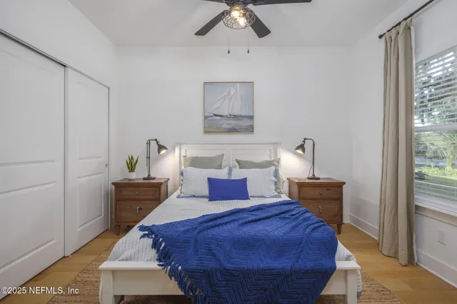 a bed room with a bed and a chandelier