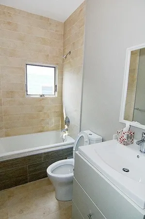 a bathroom with a sink a toilet and bathtub