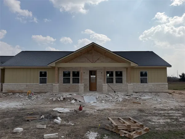 a front view of a house with yard