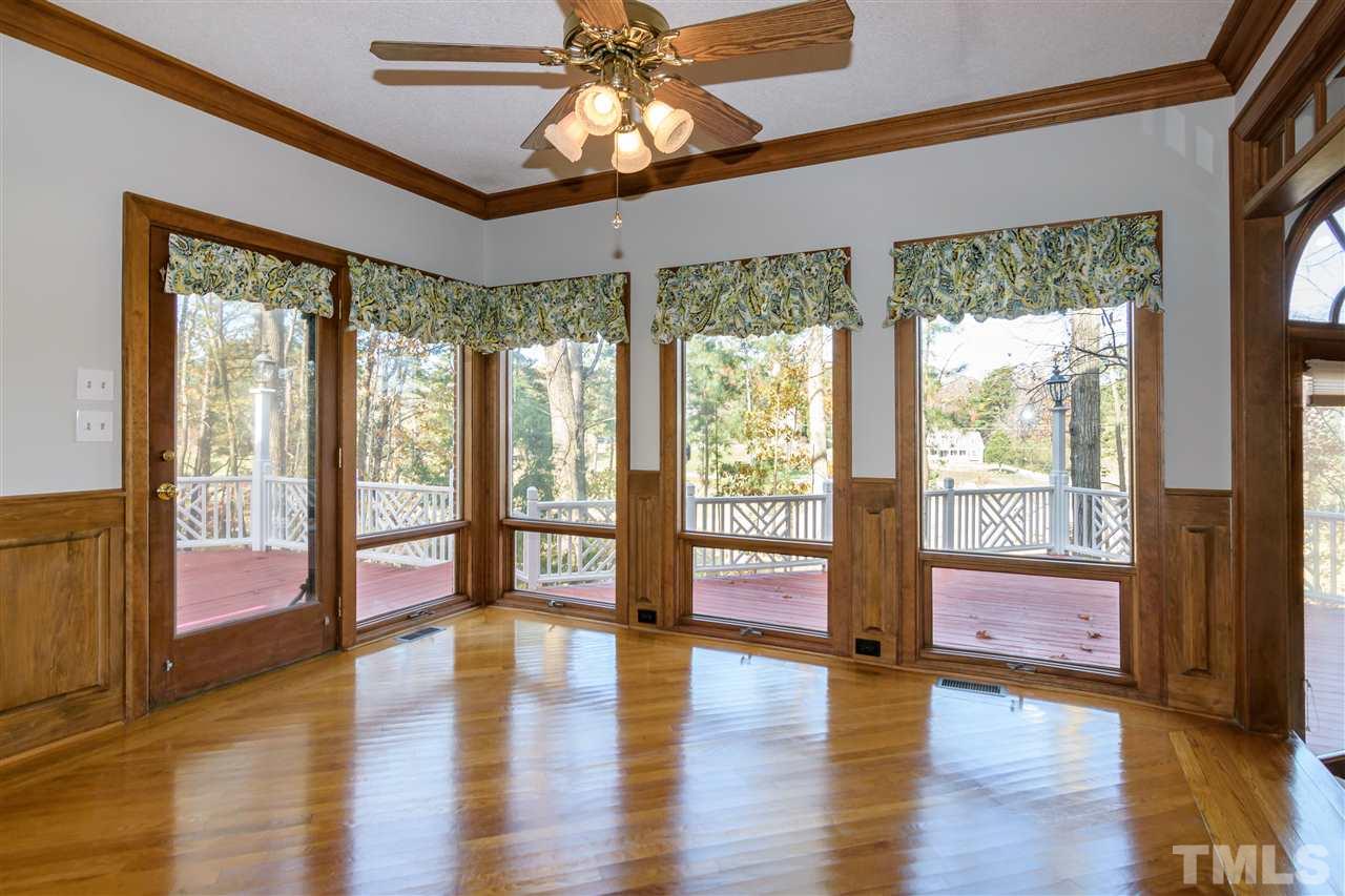 2808 Combe Hill Trail Raleigh, NC 27613 - Photo 12 of 30 a view of empty room with wooden floor and fan