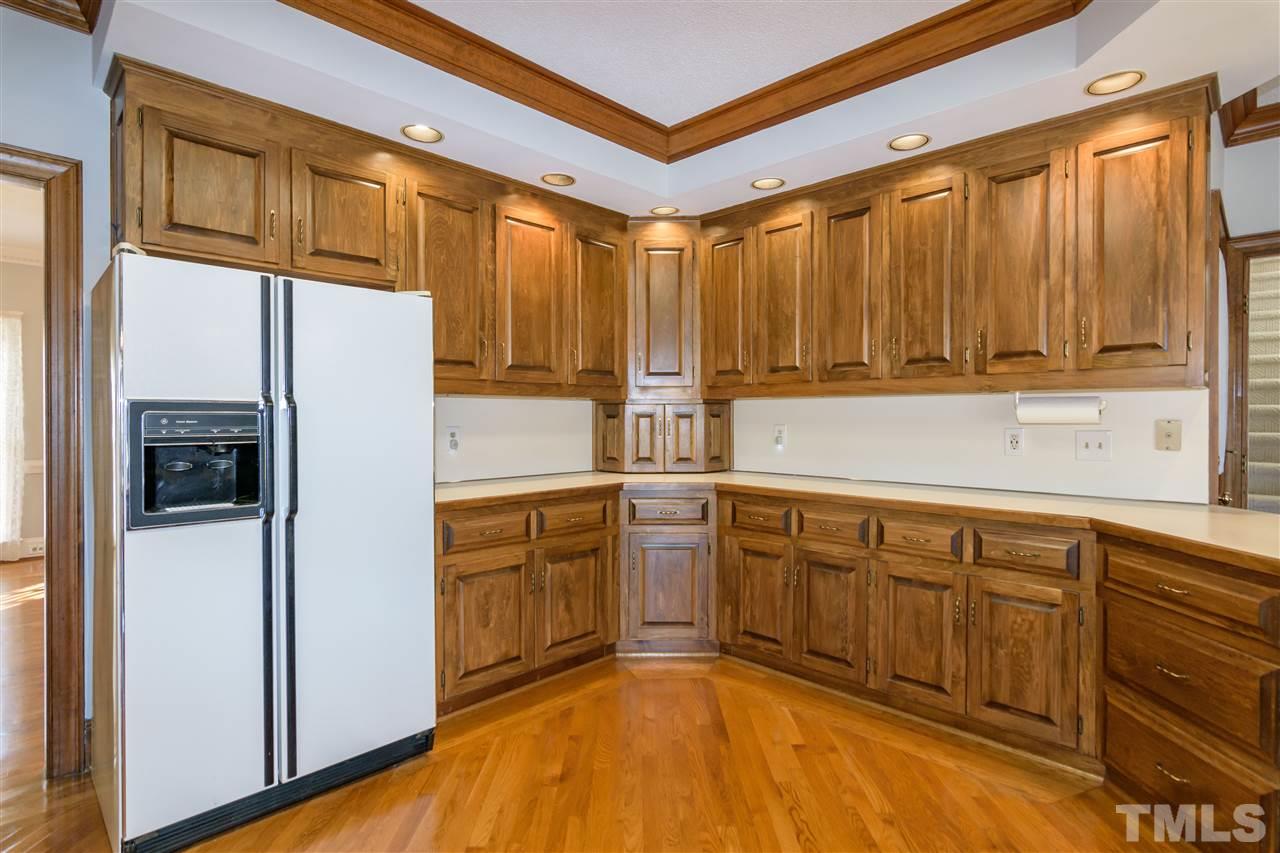 2808 Combe Hill Trail Raleigh, NC 27613 - Photo 16 of 30 a kitchen with stainless steel appliances granite countertop a refrigerator and a sink
