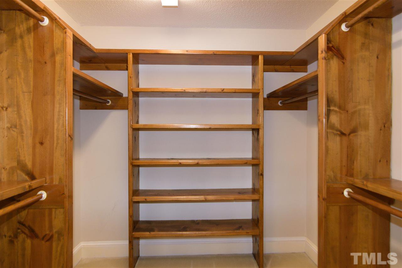 2808 Combe Hill Trail Raleigh, NC 27613 - Photo 24 of 30 a view of walk in closet with empty racks