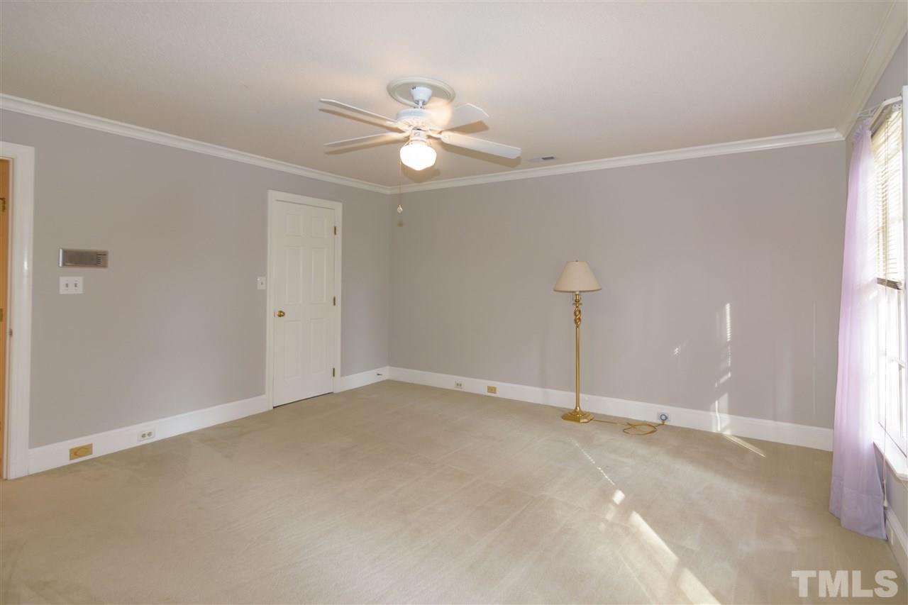 2808 Combe Hill Trail Raleigh, NC 27613 - Photo 25 of 30 a view of a room with lots of chandelier fan
