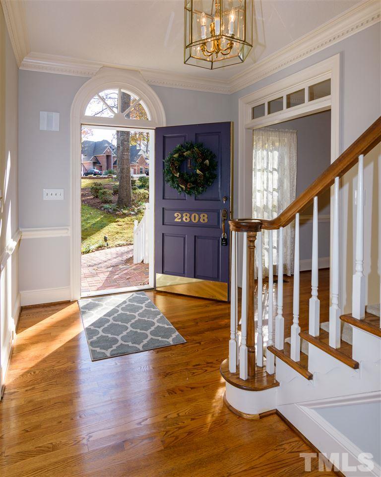 2808 Combe Hill Trail Raleigh, NC 27613 - Photo 5 of 30 a view of an entryway door with staircase