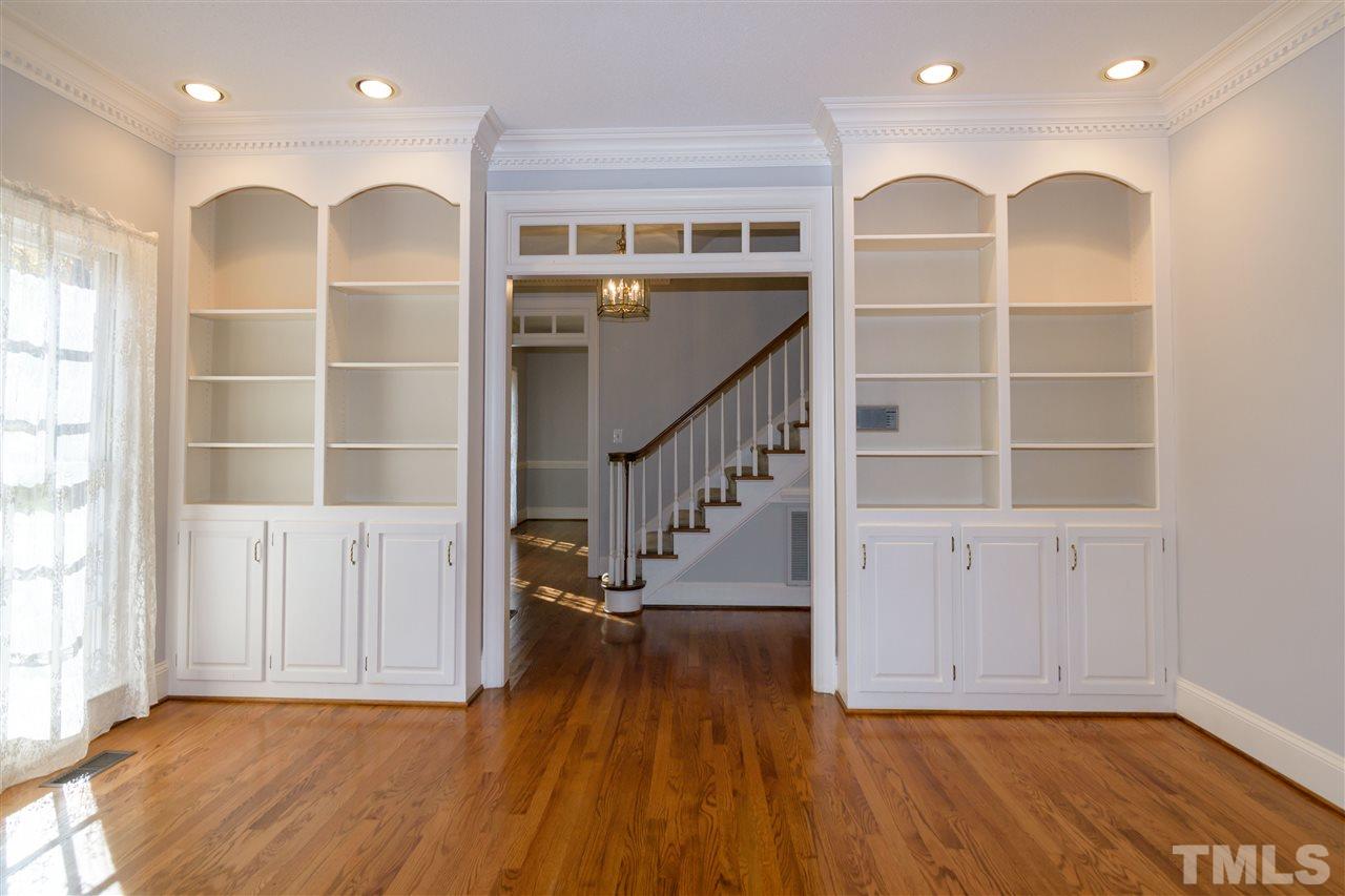 2808 Combe Hill Trail Raleigh, NC 27613 - Photo 7 of 30 a view of a livingroom with wooden floor and windows