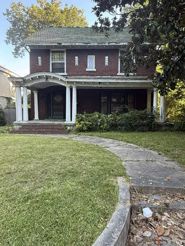 a view of a house with a garden