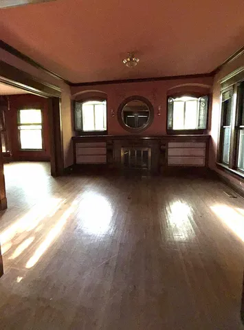 a view of room with window and fireplace