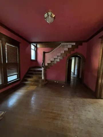 a view of an empty room with a fireplace