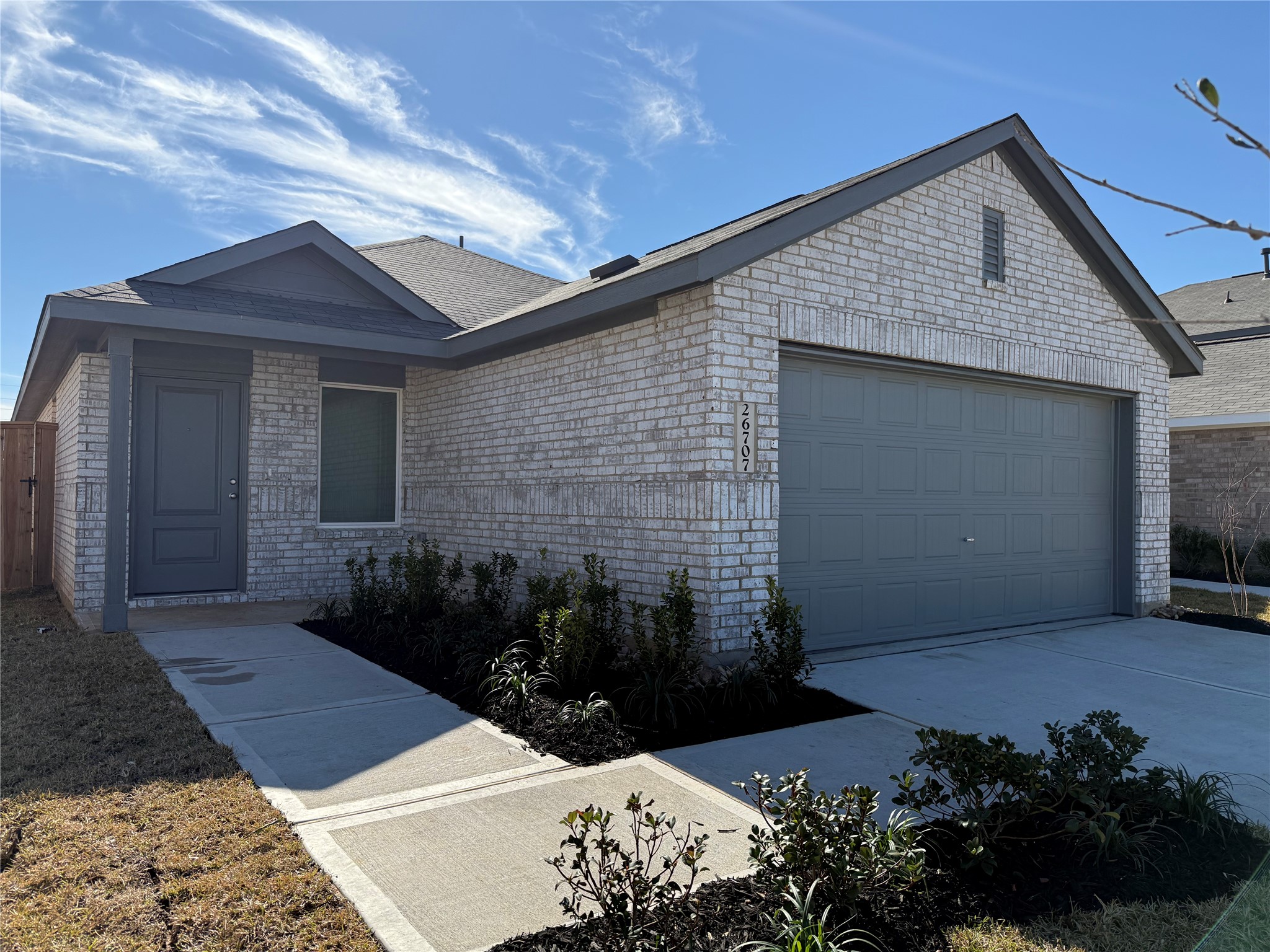 26707 Feather Reed Drive Katy, TX 77493 - Photo 2 of 18 a front view of a house with a yard