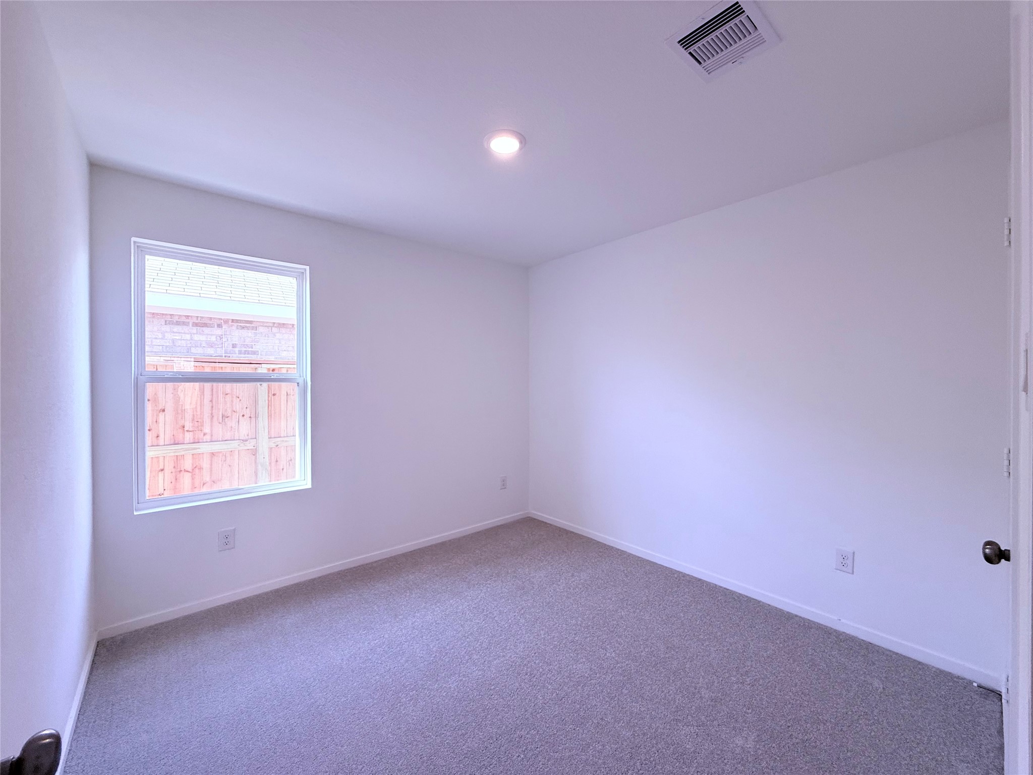 26707 Feather Reed Drive Katy, TX 77493 - Photo 7 of 18 an empty room with a window