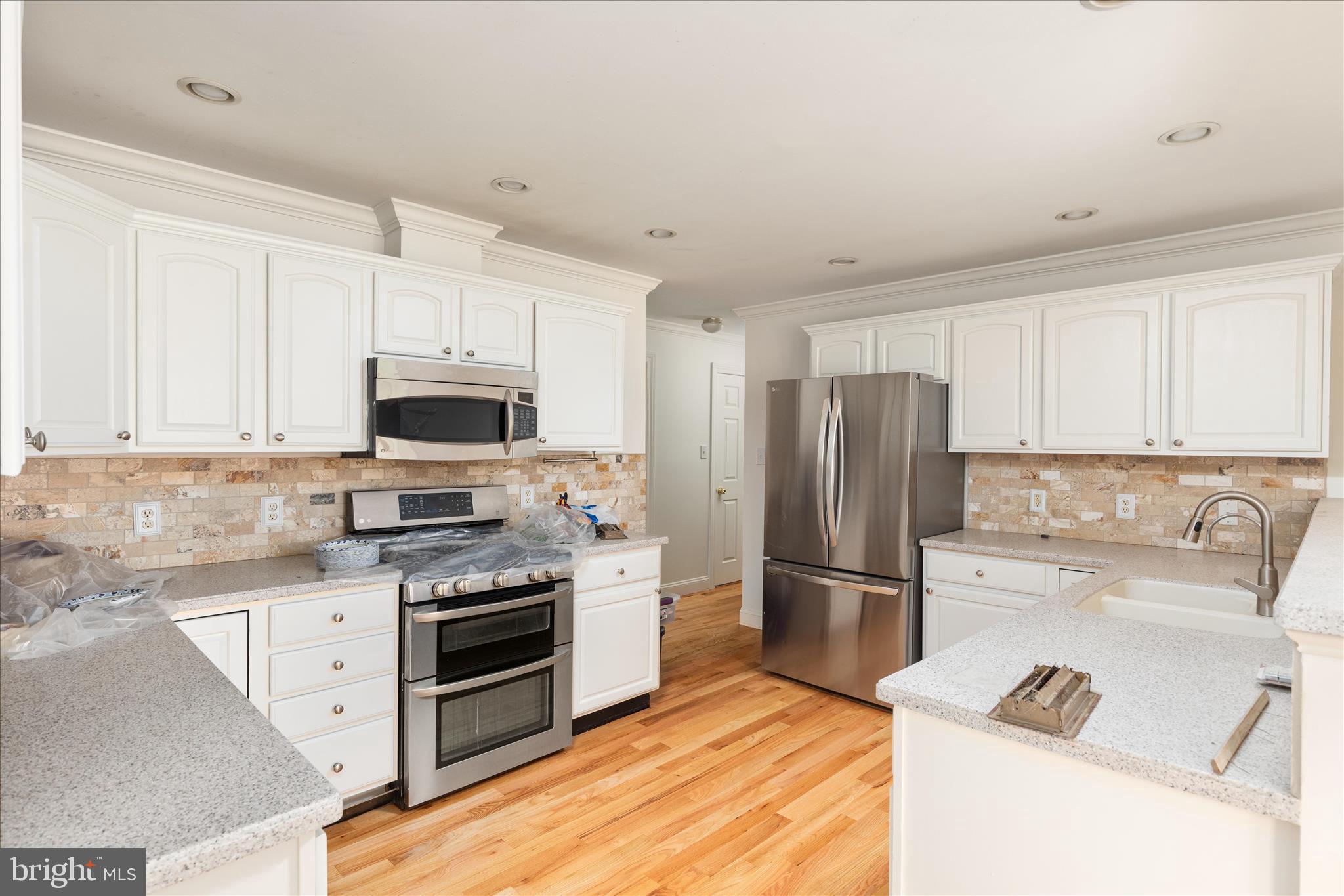 1200 Salem Church Road Stephens City, VA 22655 - Photo 13 of 69 a kitchen with granite countertop a refrigerator stove and microwave