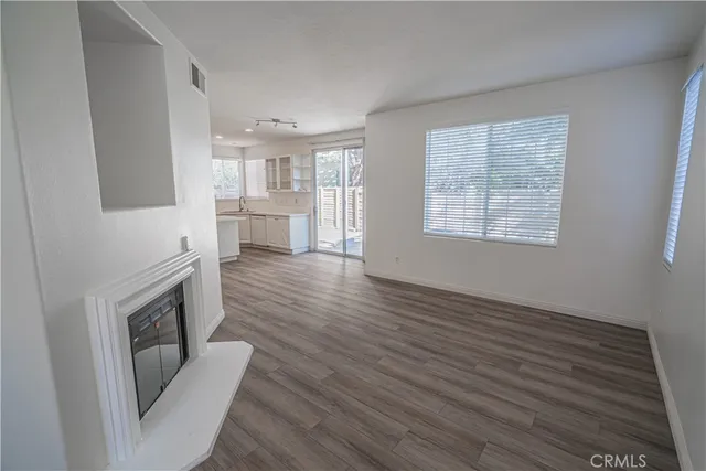 a view of living room with furniture and fireplace