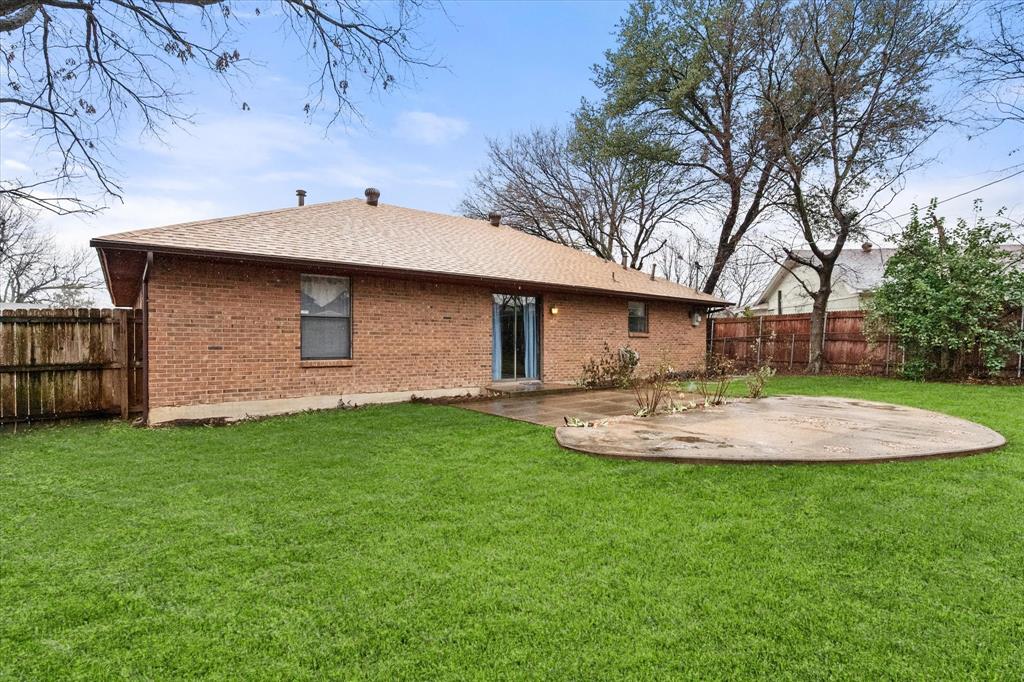2305 Gilbert Circle Arlington, TX 76010 - Photo 16 of 38 a view of a backyard with a garden and entertaining space